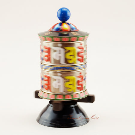 Handcrafted Tabletop Prayer Wheel spinning during Buddhist prayer ritual, symbolizing meditation, blessings, and spiritual devotion