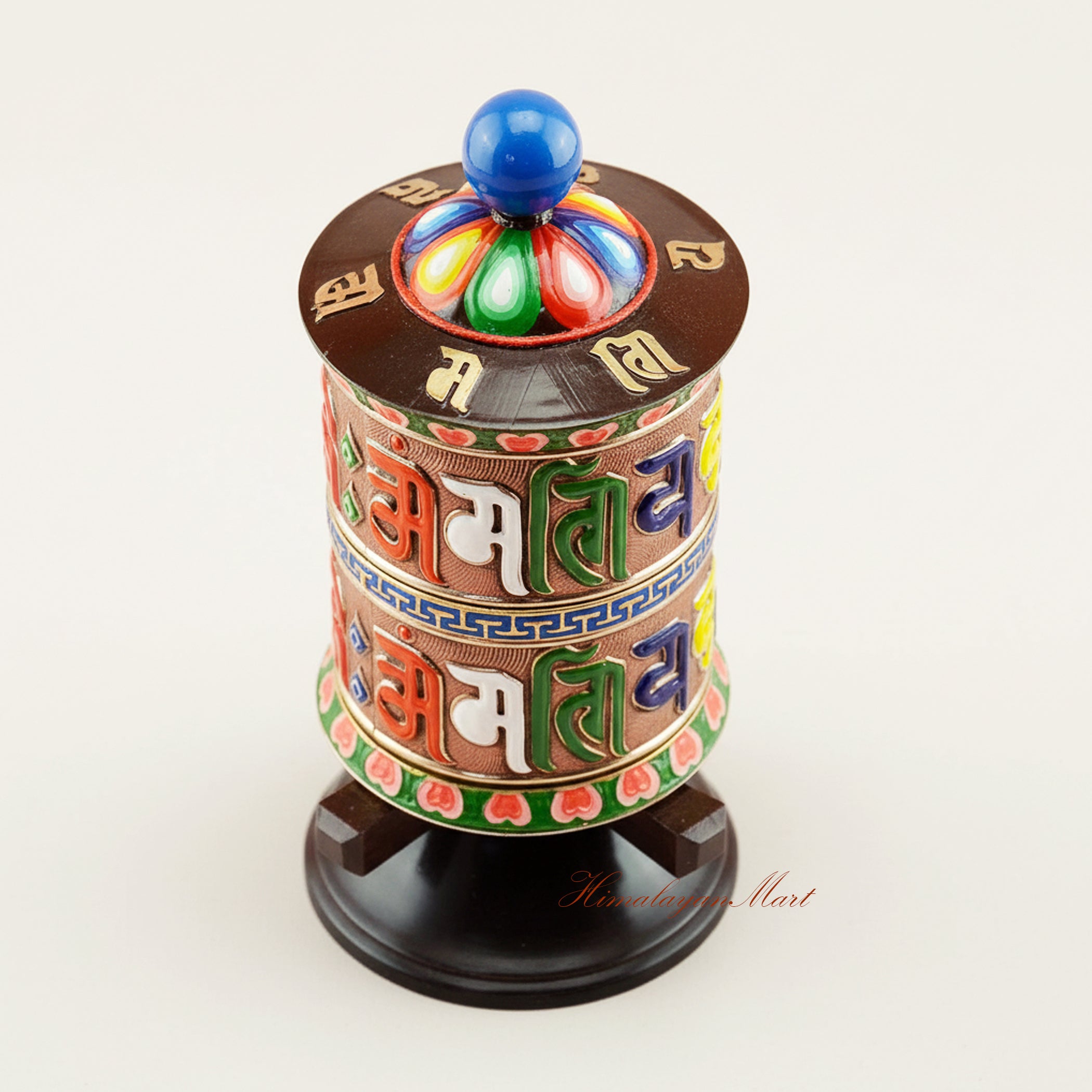 Upper detail of handcrafted Tabletop Prayer Wheel showing sacred mantra engravings and traditional Tibetan Buddhist ritual artistry