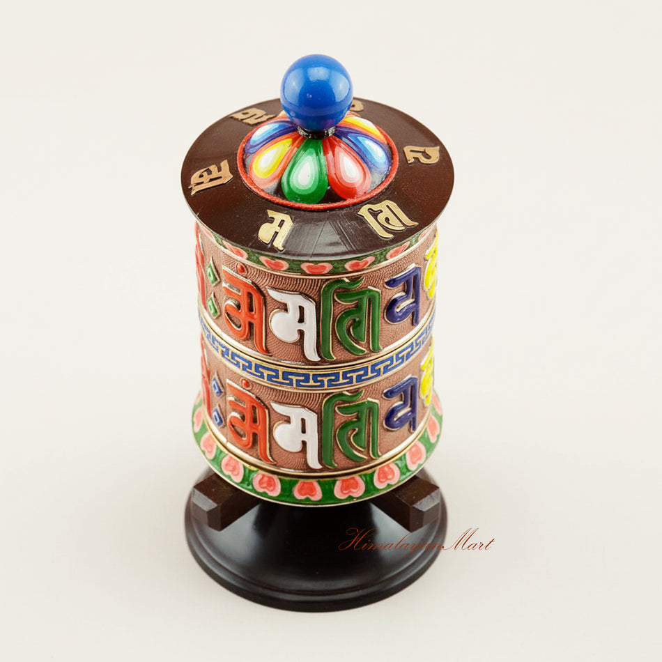 Upper detail of handcrafted Tabletop Prayer Wheel showing sacred mantra engravings and traditional Tibetan Buddhist ritual artistry