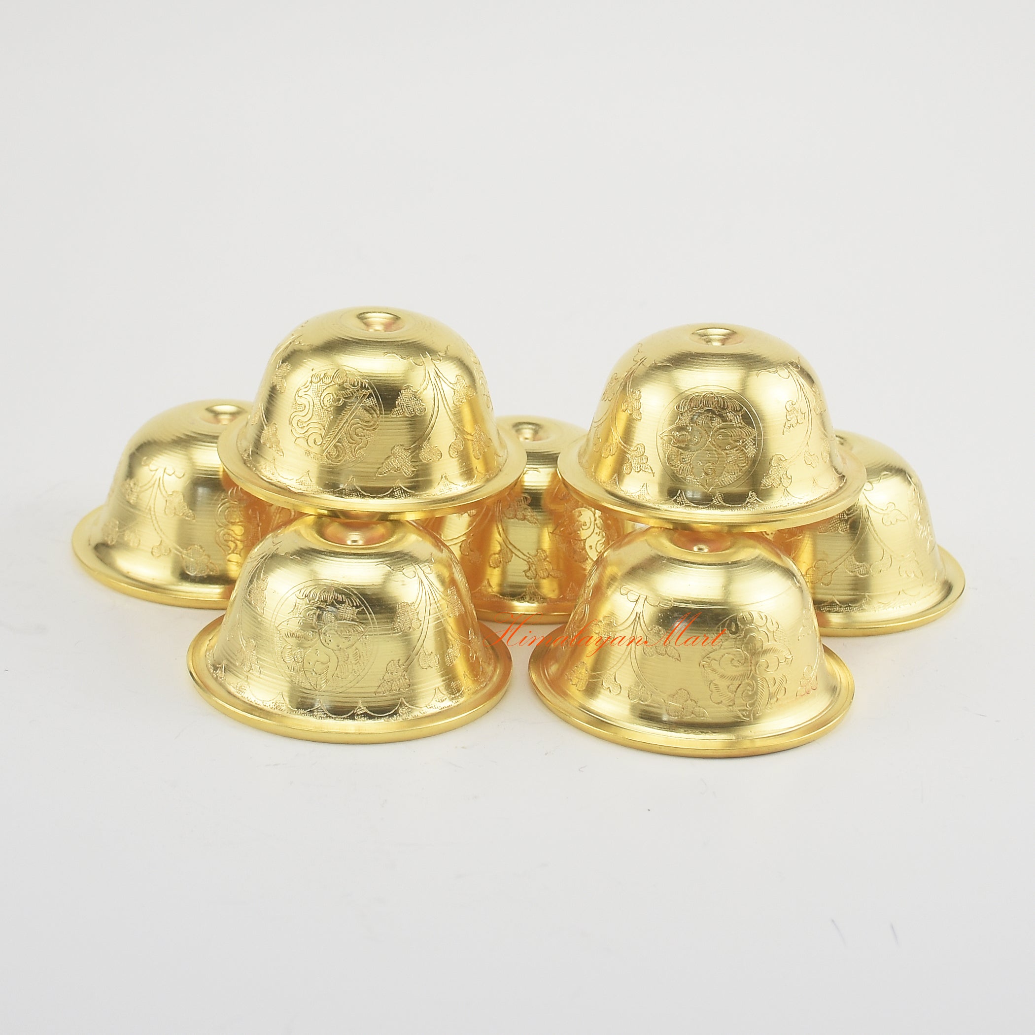 Top-down view of Tibetan Altar Offering Bowls showing intricate hand-carved Buddhist symbols and gold-plated finish.