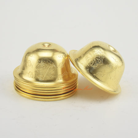 Close side view of Tibetan Altar Offering Bowls emphasizing gold-plated finish and intricate hand-carved Buddhist designs.