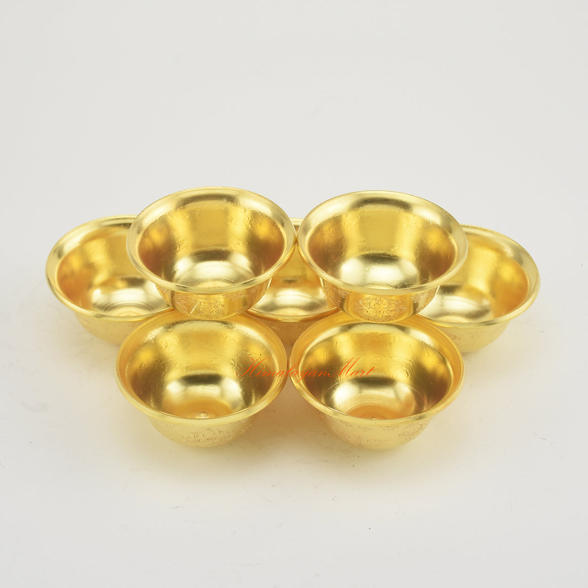 Angled upper side view of Tibetan Altar Offering Bowls highlighting craftsmanship and radiant gold plating.