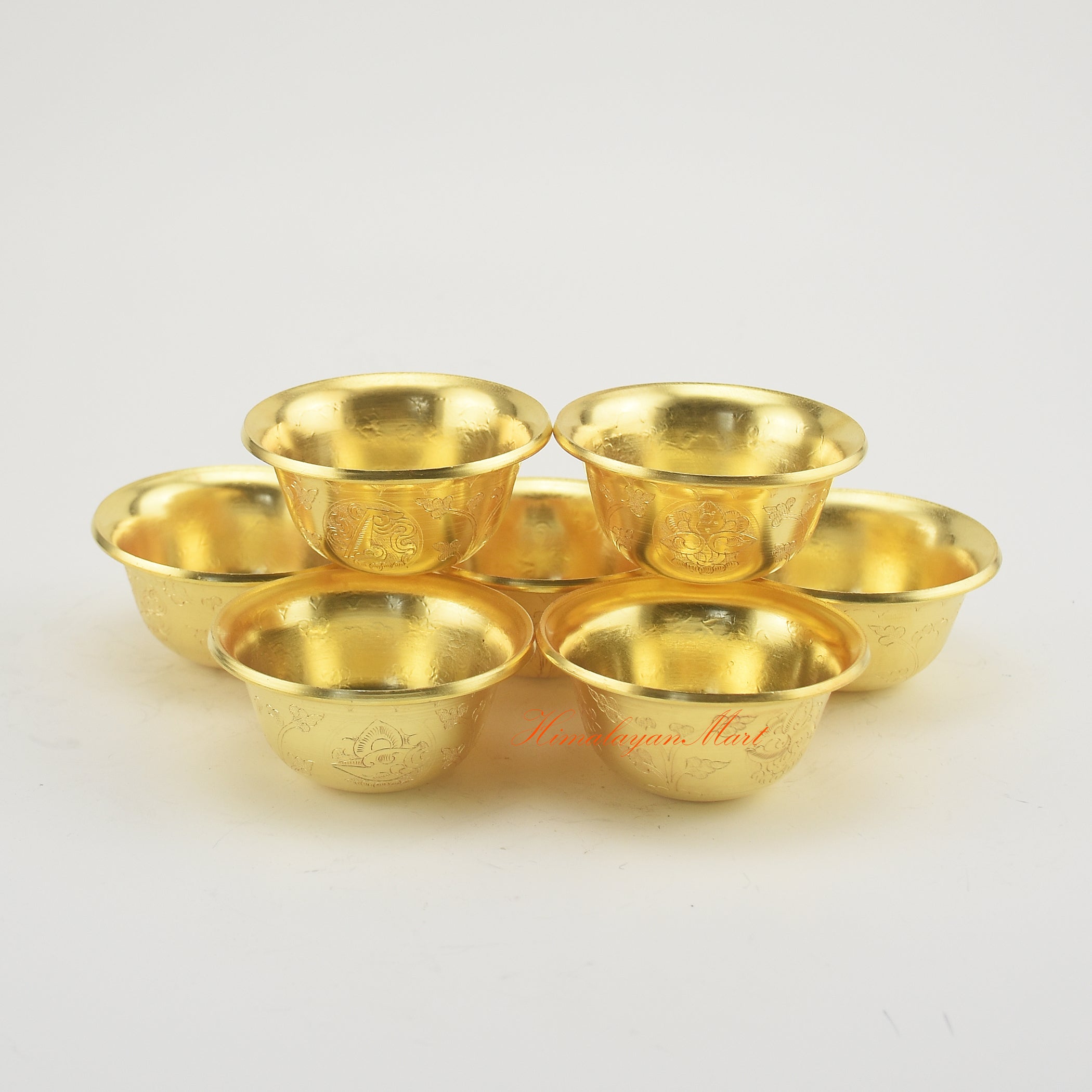 Complete set of Tibetan Altar Offering Bowls displayed on a Buddhist altar for meditation and rituals.