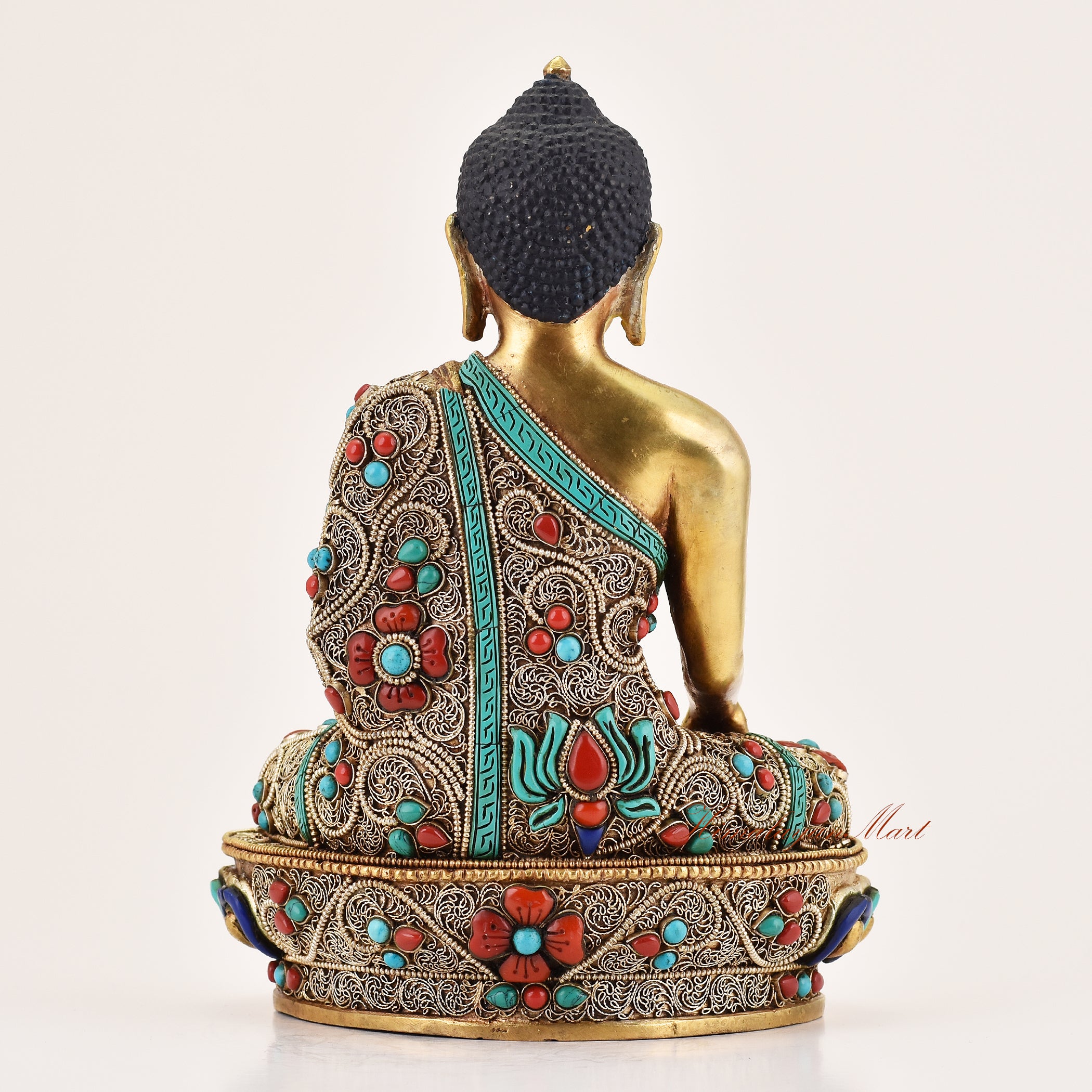Back view of handcrafted Tibetan altar statue of Shakyamuni Buddha, meditation sculpture for altar and spiritual spaces