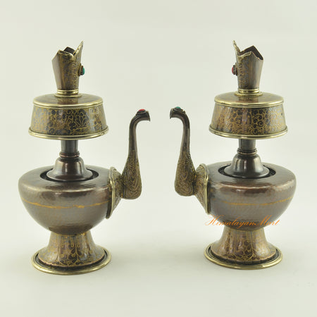 Tibetan Bhumba Set displayed together, sacred Buddhist water offering vessels in oxidized copper with brass rings and stone inlay