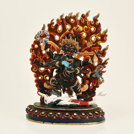 Front view of handcrafted Tibetan Black Mahakala statue with 24-karat gold gilding, made in Patan, Nepal