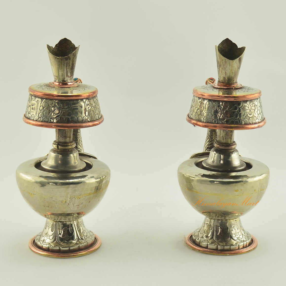 Back view of Tibetan Buddhist Ritual Bhumba set showing white metal surface, copper rings, and traditional craftsmanship