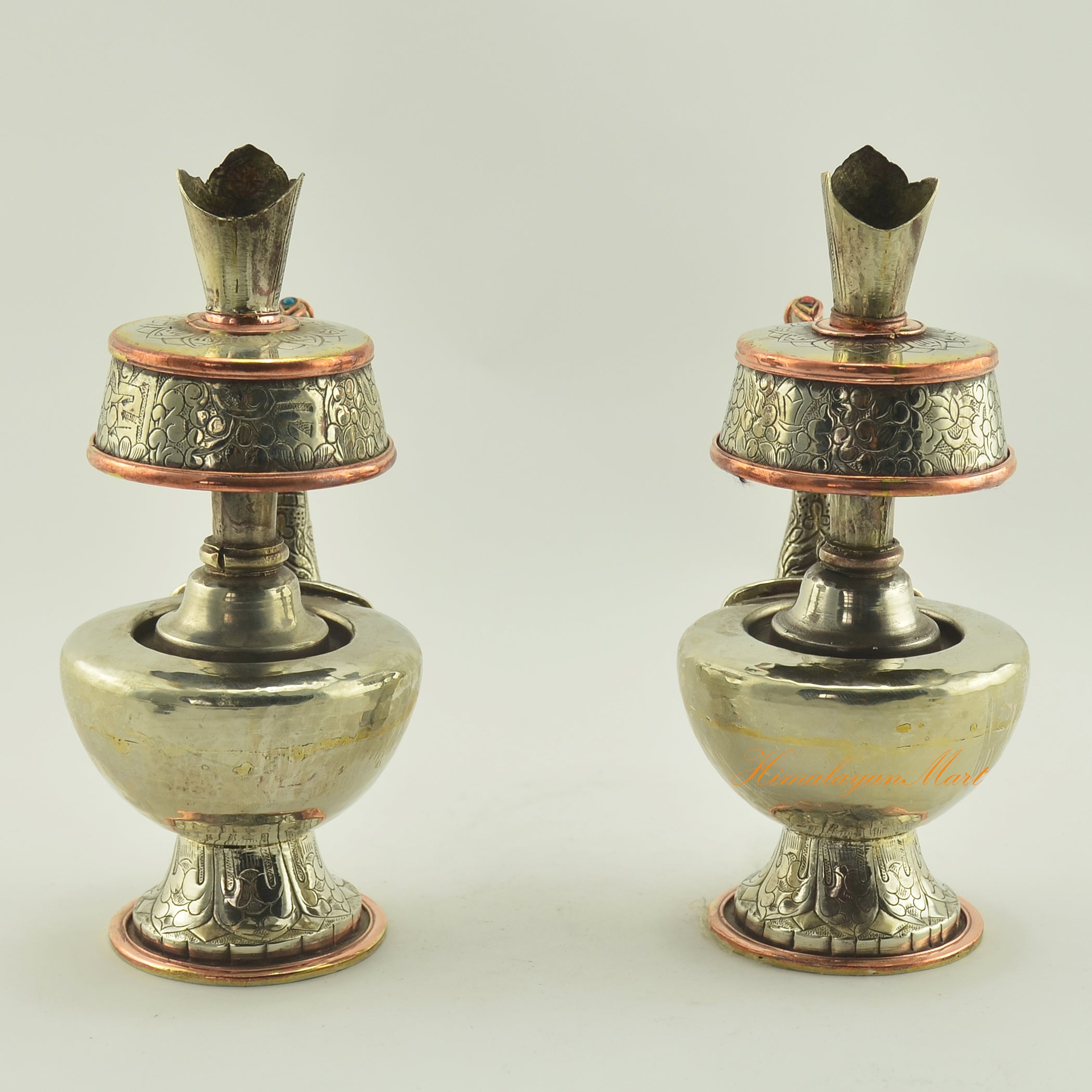 Back view of Tibetan Buddhist Ritual Bhumba set showing white metal surface, copper rings, and traditional craftsmanship