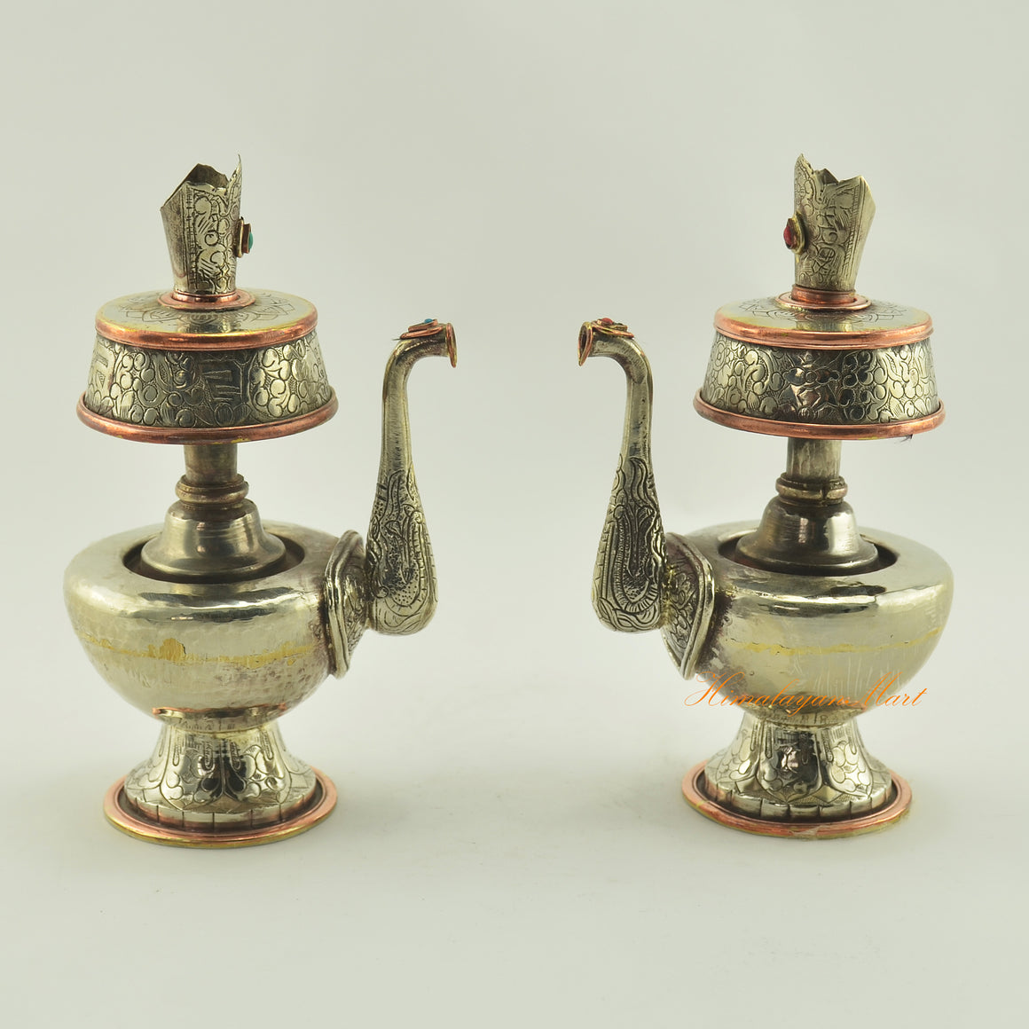 Tibetan Buddhist Ritual Bhumba set in white metal alloy with copper rings, shown side by side with hand carvings and coral turquoise inlay