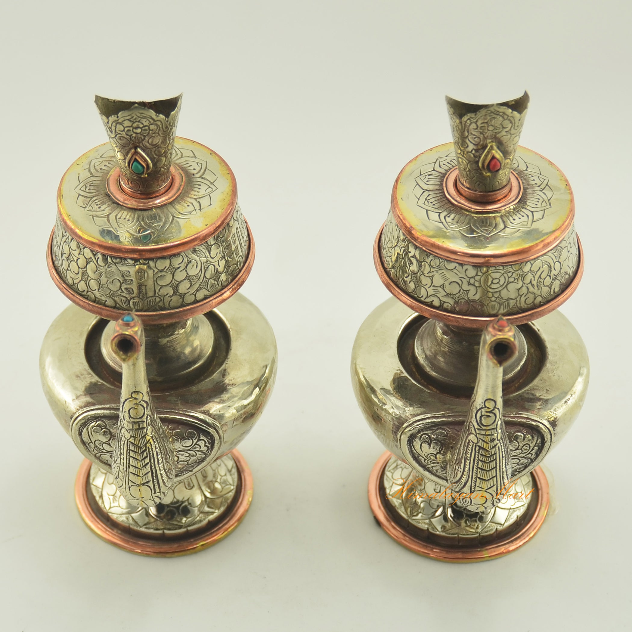 Upper view of Tibetan Buddhist Ritual Bhumba offering vase set highlighting hand carvings and inlaid coral and turquoise