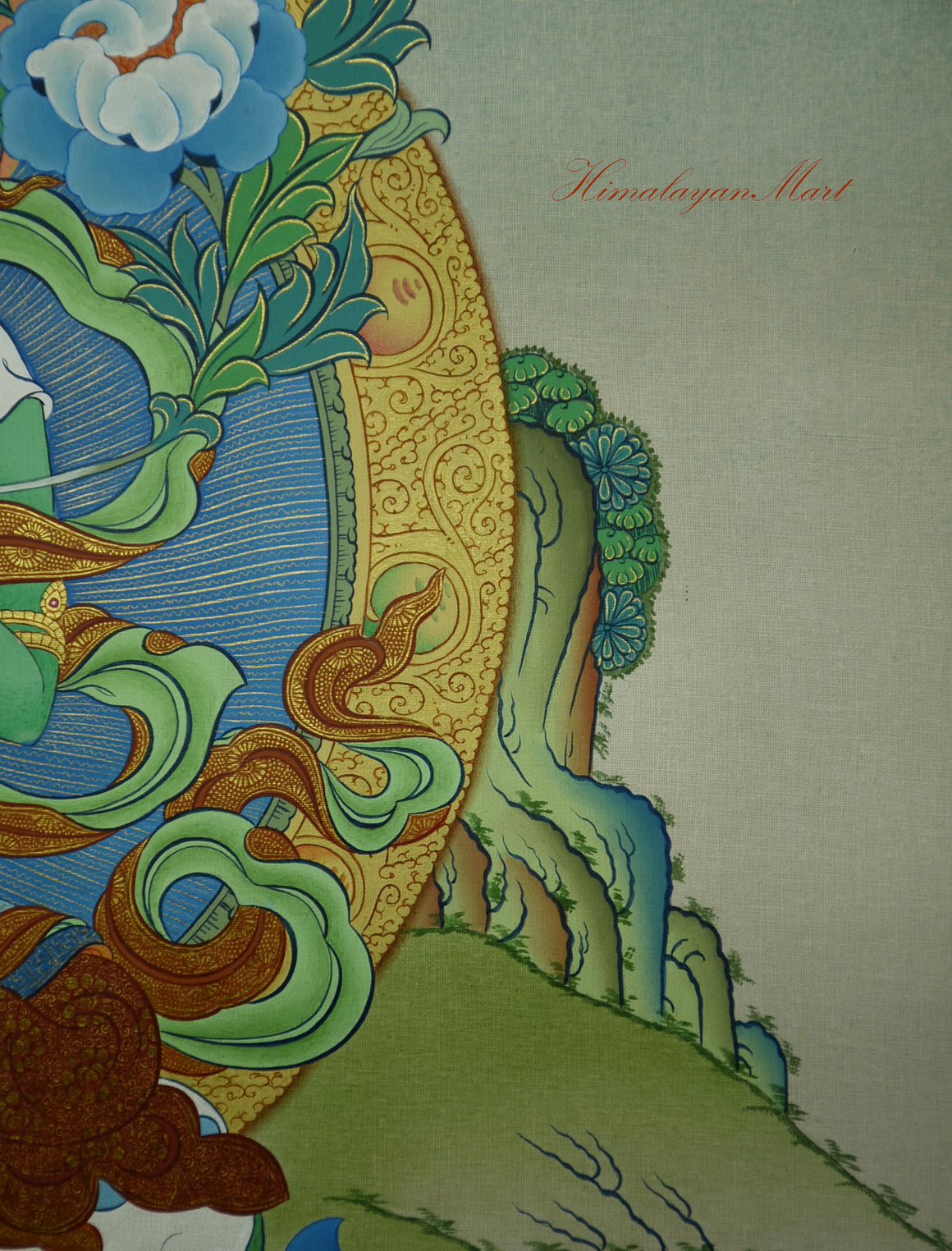 Close-up of Green Tara’s left hand holding Utpala lotus with three symbolic blossoms.