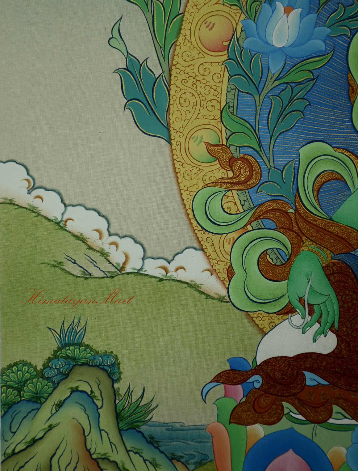 Close-up of Green Tara’s right hand in Varada Mudra holding a blooming blue lotus.