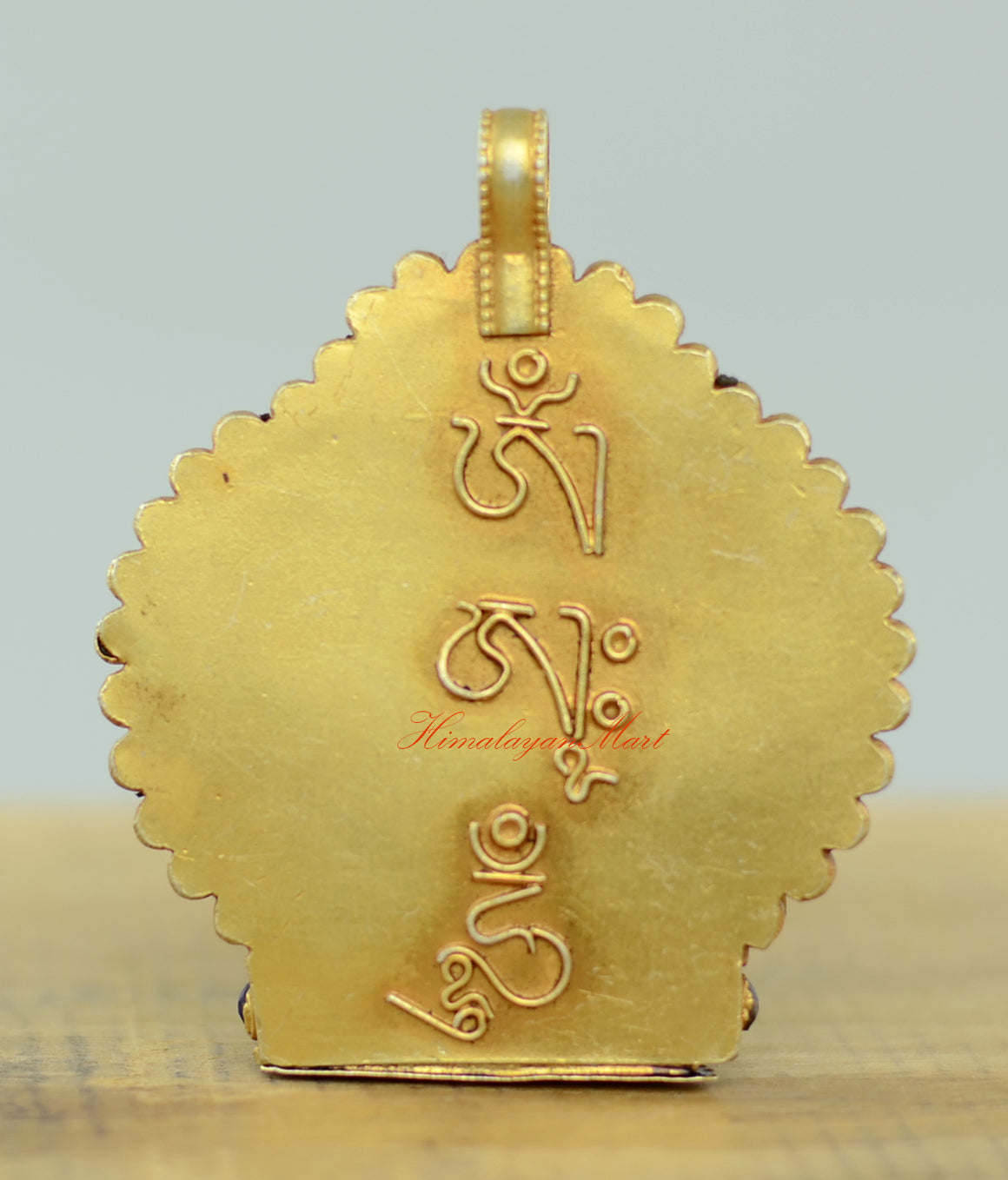 Back view of the Tibetan Chenrezig Locket showing intricate filigree patterns and silver craftsmanship.