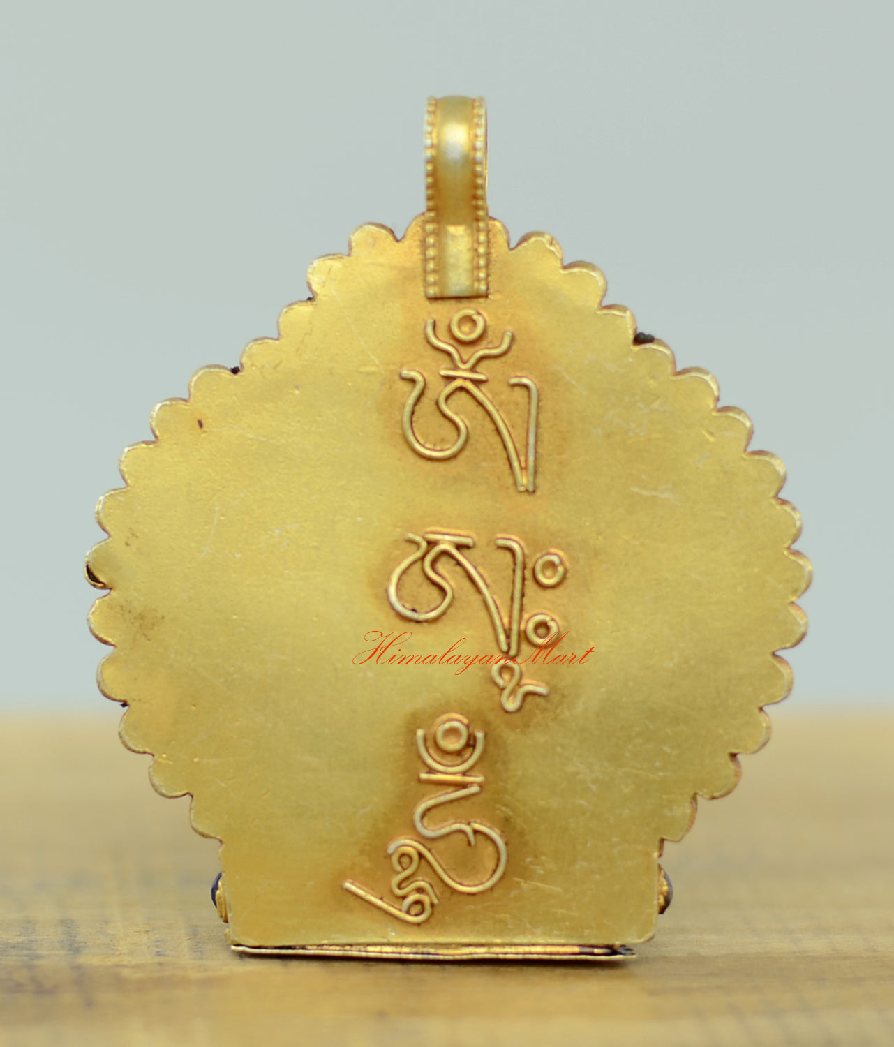 Back view of the Tibetan Chenrezig Locket showing intricate filigree patterns and silver craftsmanship.