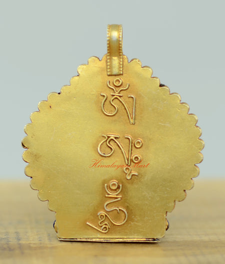 Back view of the Tibetan Chenrezig Locket showing intricate filigree patterns and silver craftsmanship.