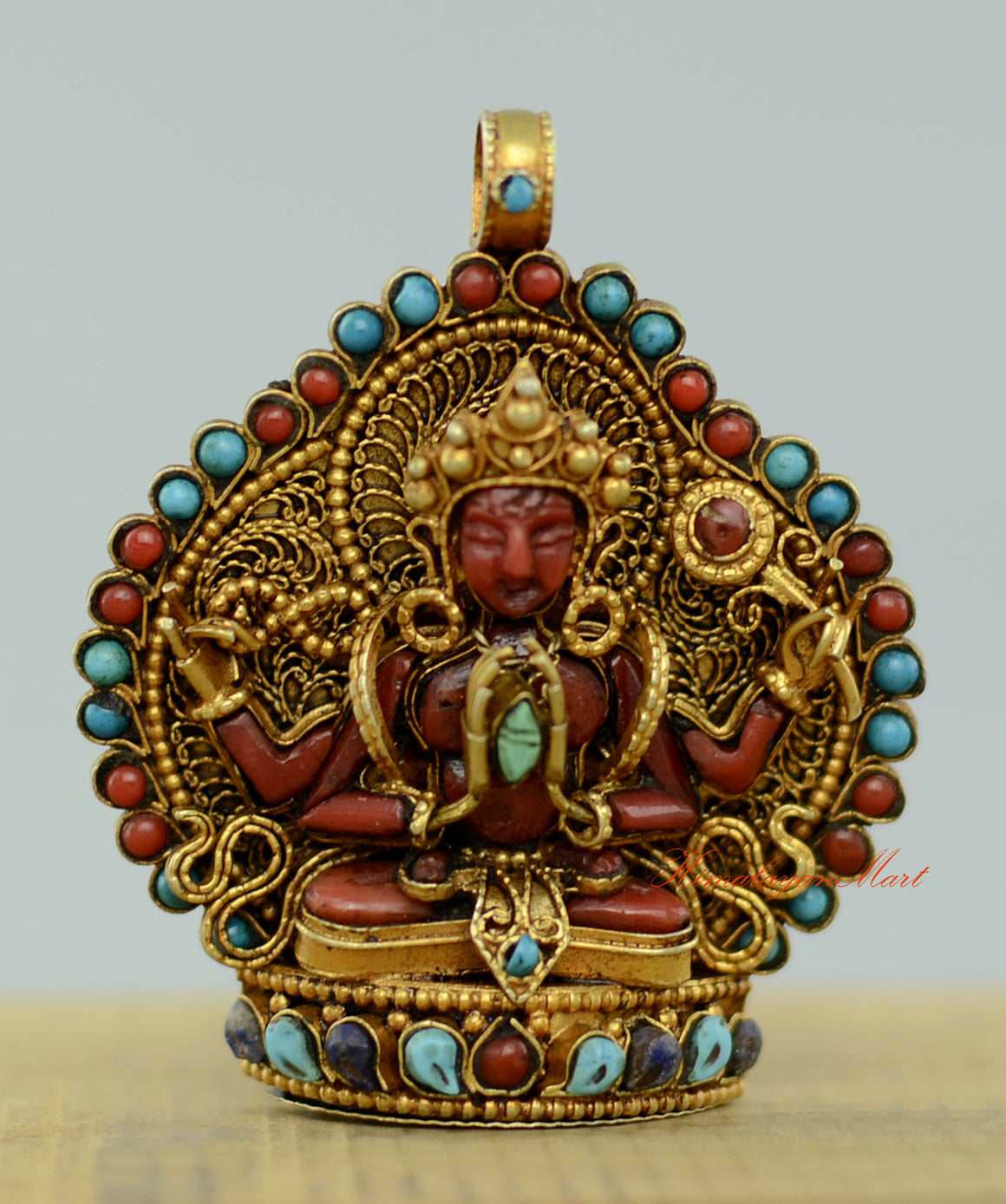 Tibetan Chenrezig Locket with silver filigree, gold-plated accents, and coral, turquoise, and lapis gemstone inlay.
