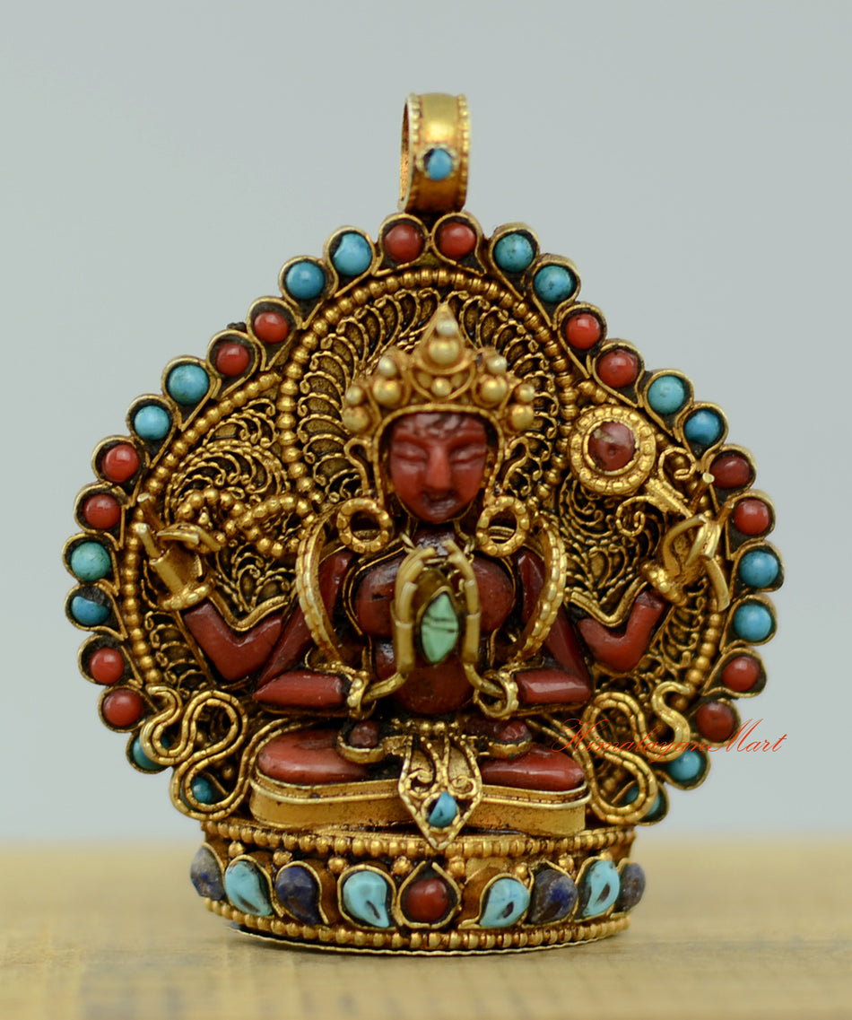 Tibetan Chenrezig Locket with silver filigree, gold-plated accents, and coral, turquoise, and lapis gemstone inlay.