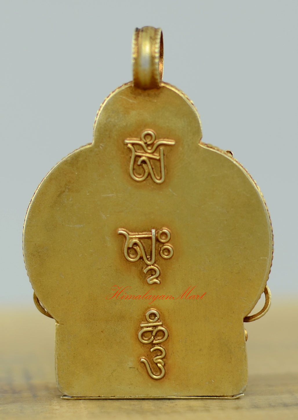 Back view of the Tibetan Green Tara Locket showing detailed hand-carved filigree and silver craftsmanship.