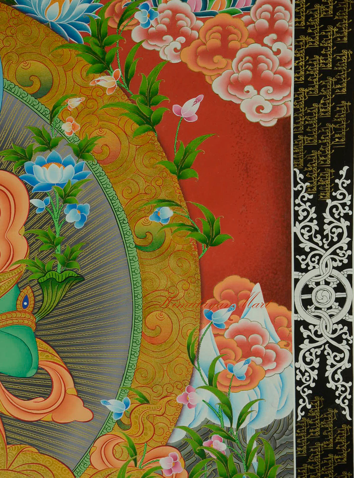 Snow-capped mountain detail on the left side of the Tibetan Green Tara Thangka.