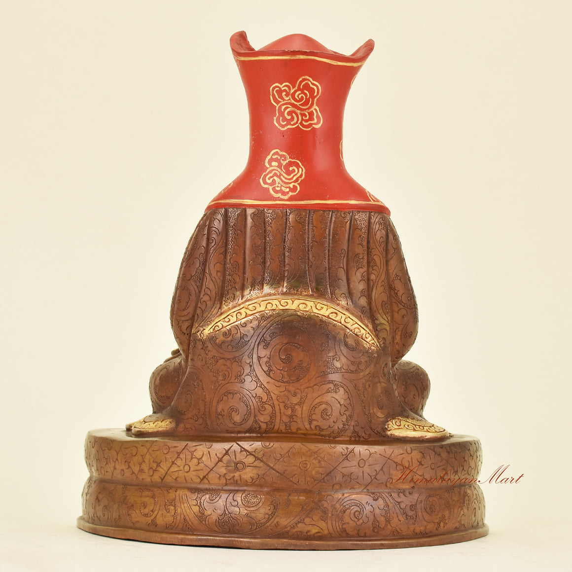 Back view of Tibetan Guru Gampopa Statue showing traditional robes of a Kagyu lineage Buddhist teacher