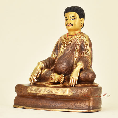 Left side view of Tibetan Guru Marpa Statue, great Kagyu translator and Buddhist master