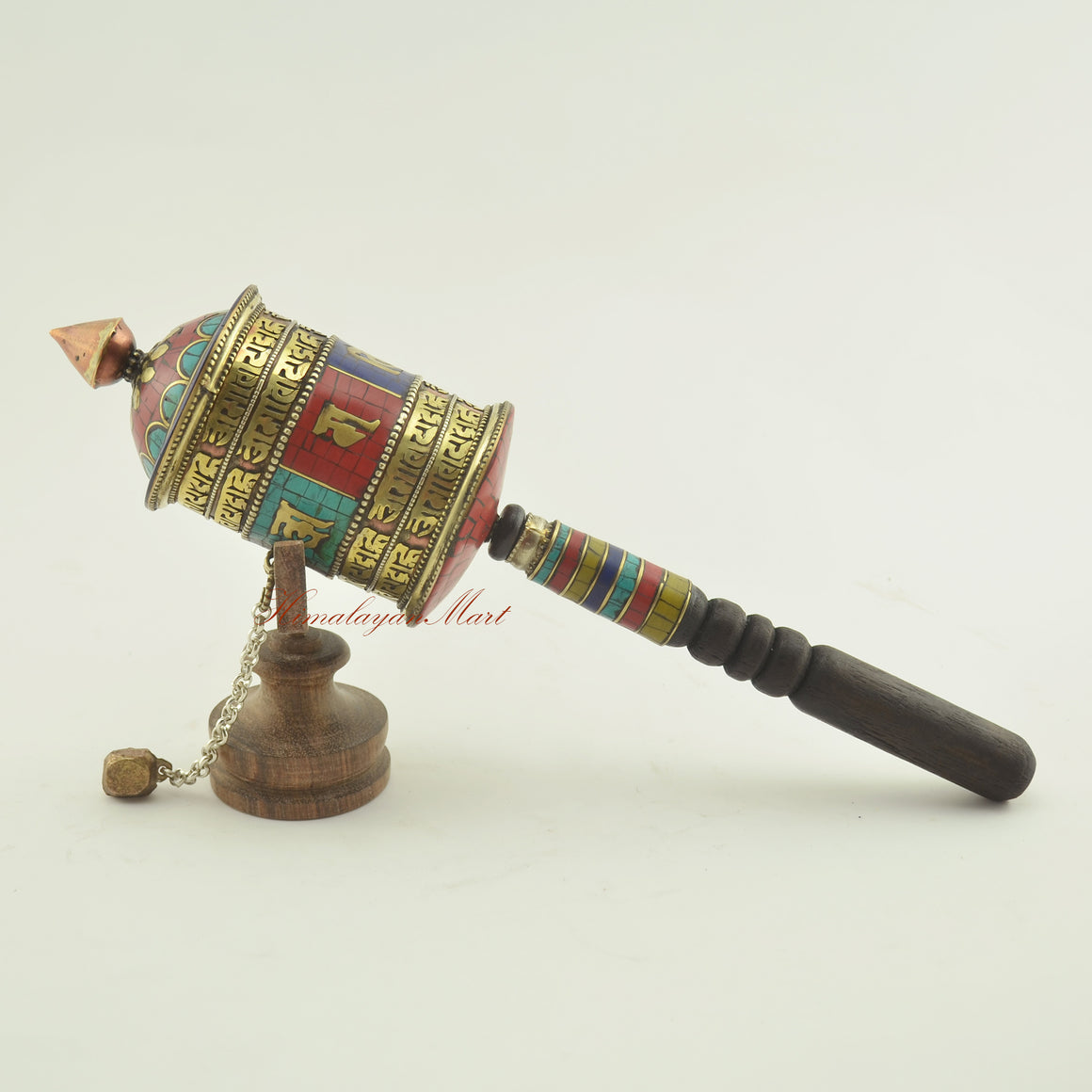 Tibetan Handheld Prayer Wheel shown from the left side – spiritual tool for mantra recitation and mindfulness