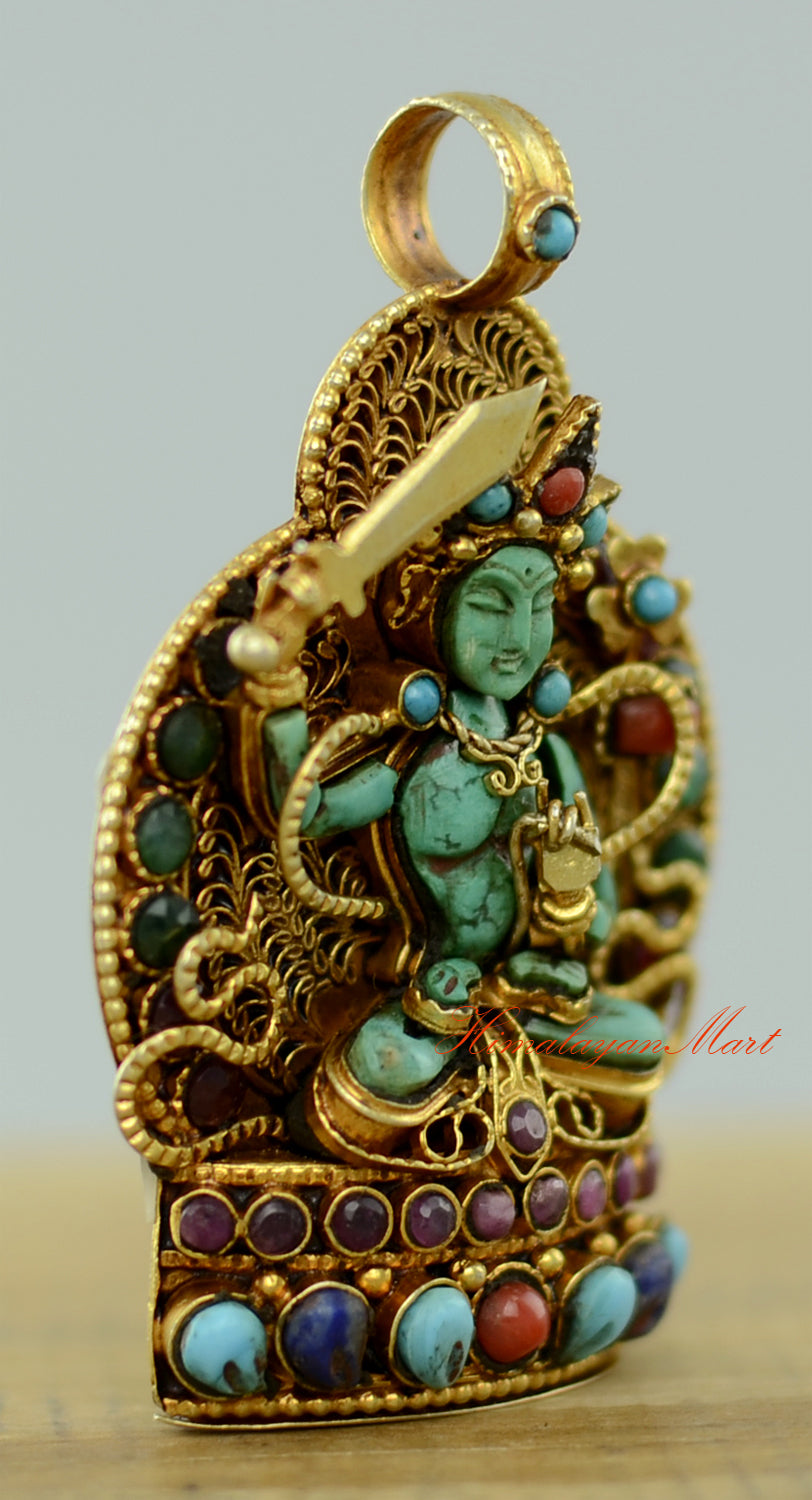Right-side view of the Tibetan Manjushri Locket highlighting gold-plated accents and gemstone inlay.