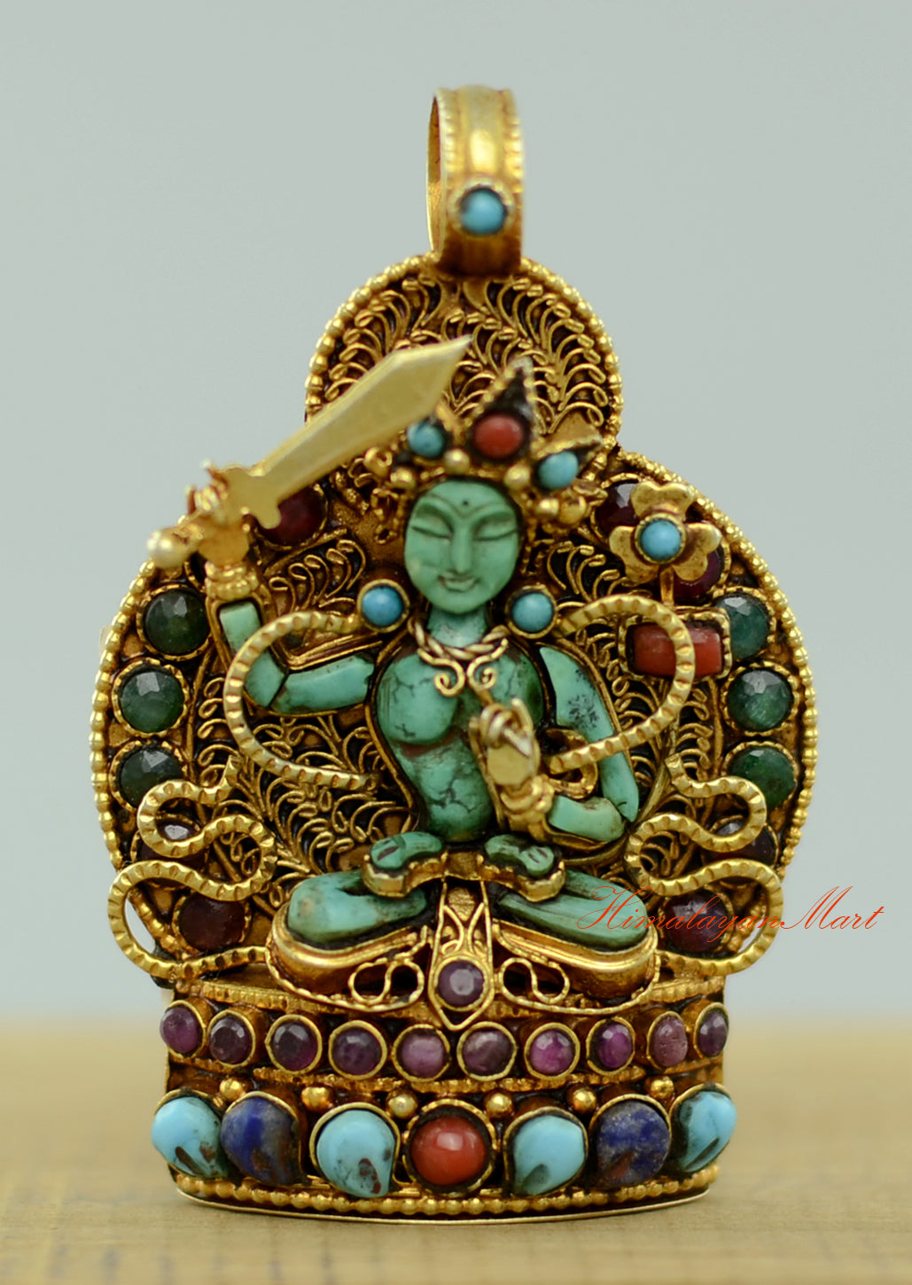 Tibetan Manjushri Locket with silver filigree, gold-plated accents, and turquoise, coral, emerald, and lapis gemstone inlay.