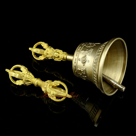 Right side view of hand-engraved Vajra and Bell showing traditional Buddhist motifs and mantra script on the bronze surface