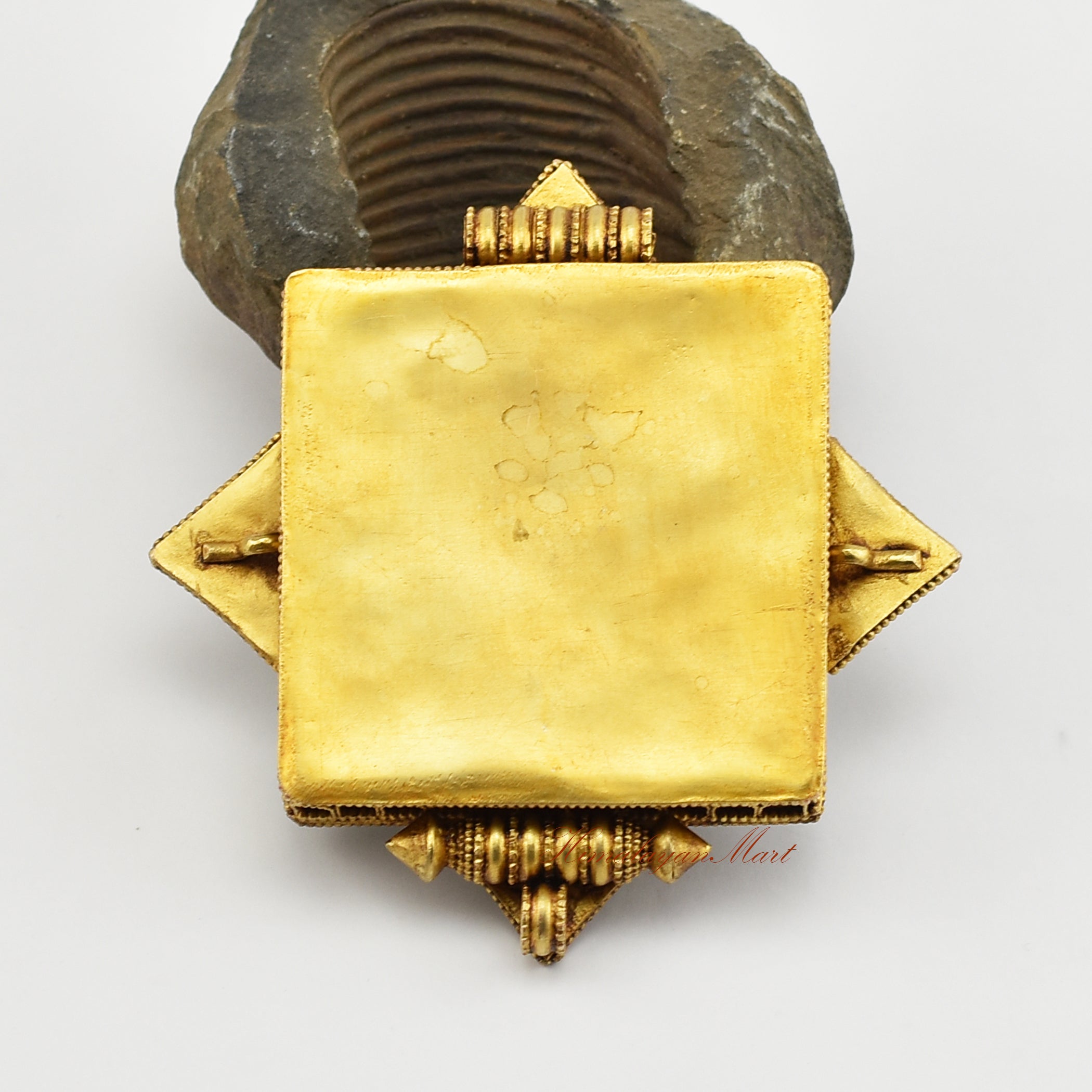 Back view of the Tibetan Religious Prayer Box Pendant showing detailed filigree carvings and gold-plated craftsmanship.