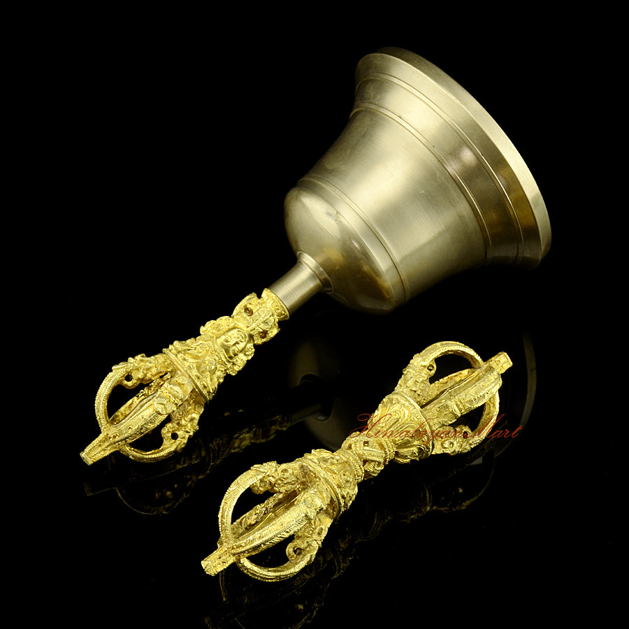 Right side view of hand-engraved Vajra and Bell showing traditional Buddhist motifs and mantra script on the bronze surface
