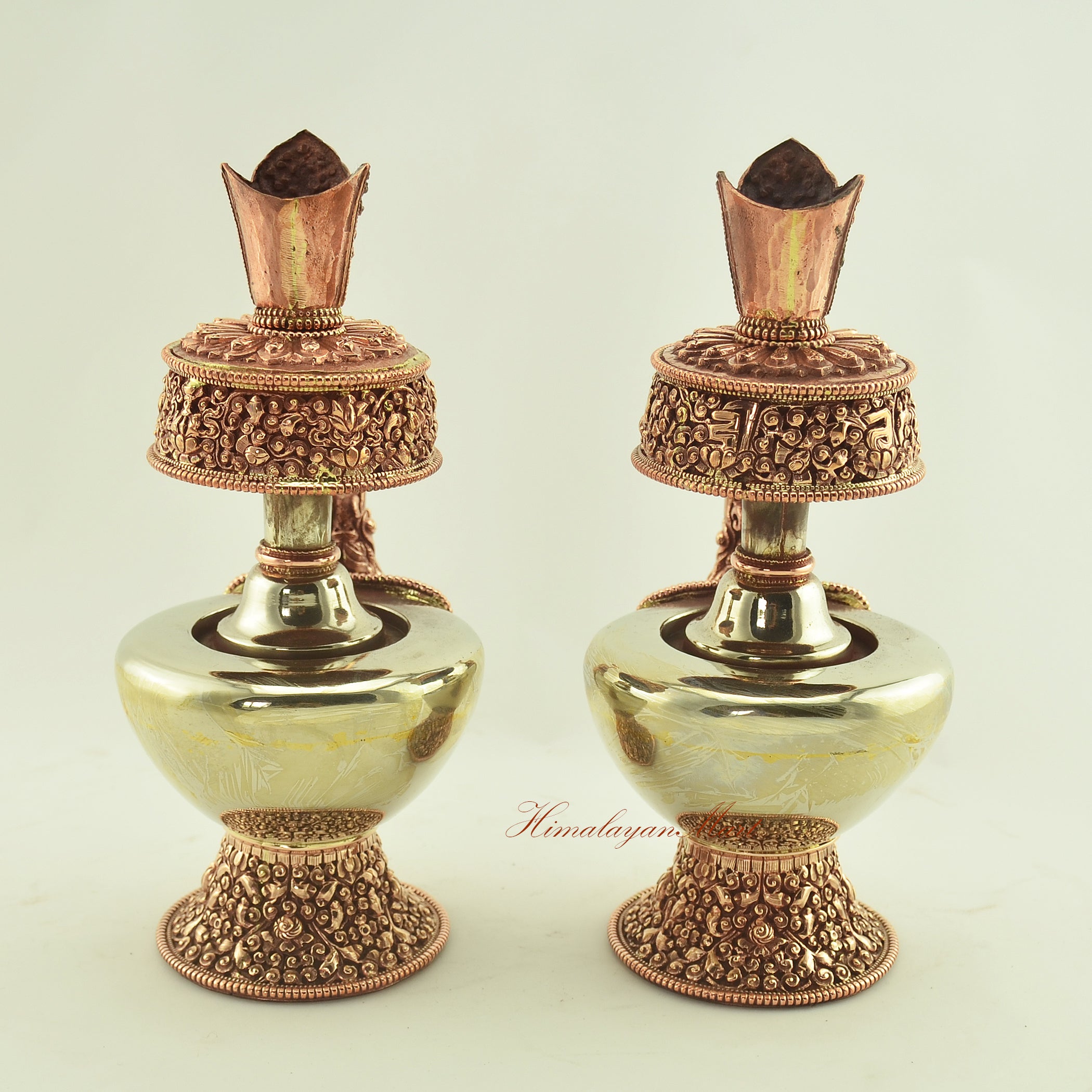 Back view of the Tibetan Ritual Bhumba Set, handcrafted with white metal and copper, featuring detailed Buddhist symbols.