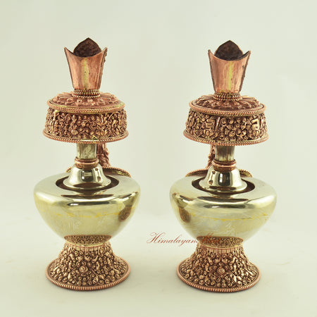 Back view of the Tibetan Ritual Bhumba Set, handcrafted with white metal and copper, featuring detailed Buddhist symbols.