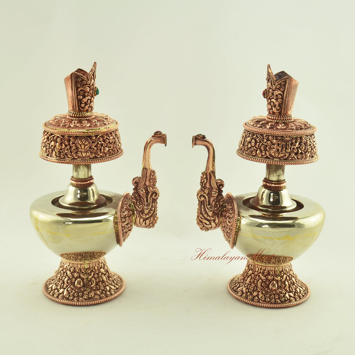 Two Tibetan Ritual Bhumba Set vases displayed together, handcrafted from copper and white metal with coral and turquoise inlay.