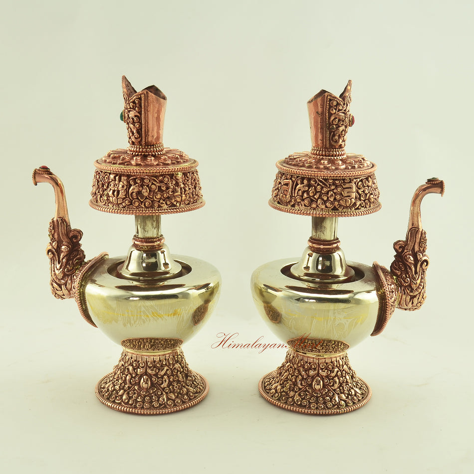 Angled view of the Tibetan Ritual Bhumba Set showing left and right sides, highlighting intricate hand-carved Buddhist symbols.