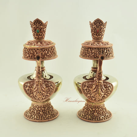 Front view of the Tibetan Ritual Bhumba Set, handcrafted with copper, white metal, and semi-precious coral and turquoise stones.