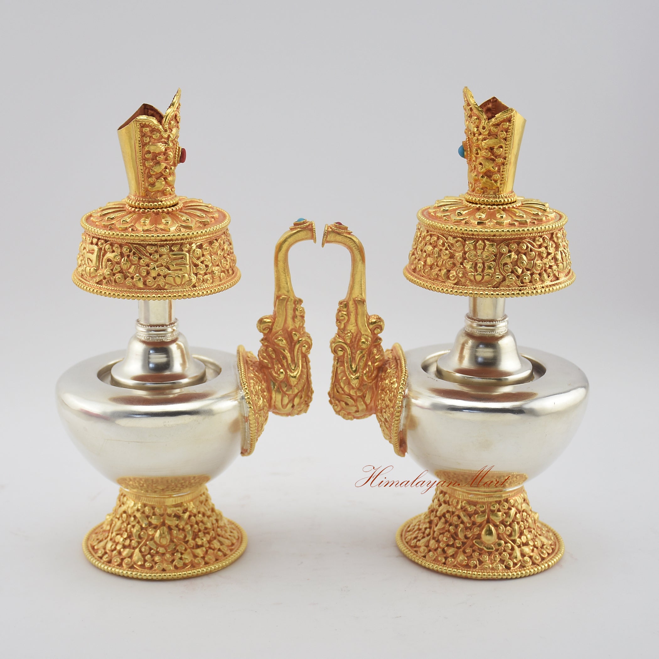Side-by-side view of two Tibetan Ritual Bumpa Vases highlighting artisan craftsmanship and stone inlay