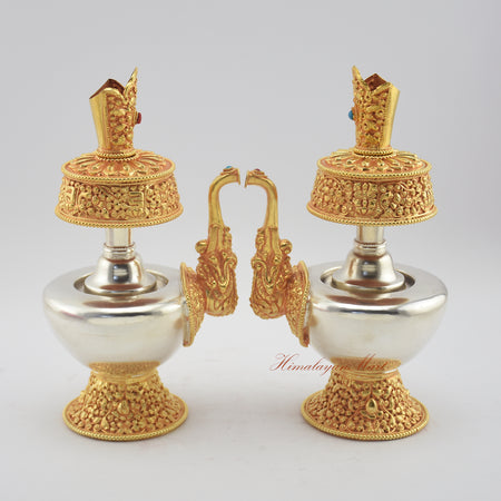 Side-by-side view of two Tibetan Ritual Bumpa Vases highlighting artisan craftsmanship and stone inlay