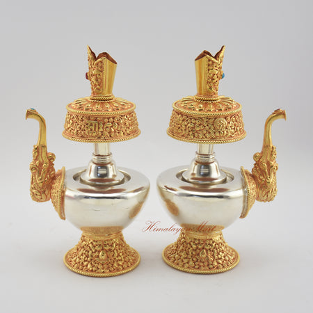 Angled view of Tibetan Ritual Bumpa Vase showing left and right sides with hand-applied decorations