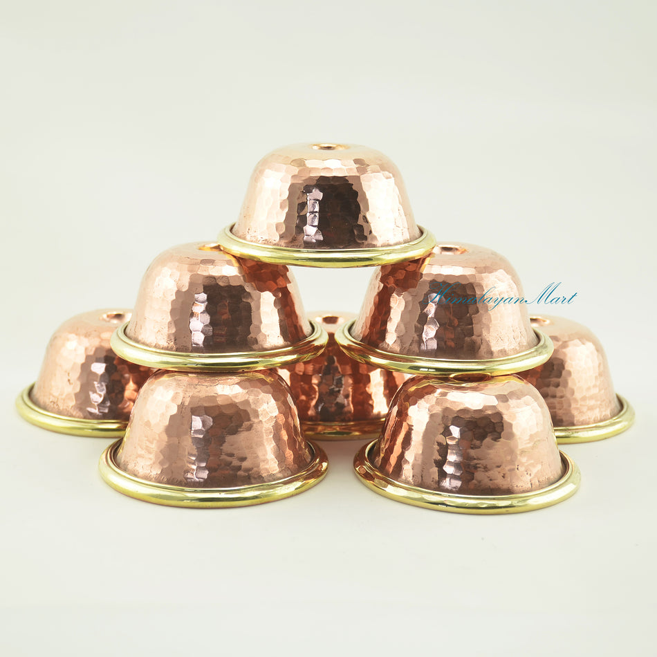 Top-down view of Tibetan Ritual Offering Bowl Set showing hand-beaten copper alloy texture and brass rim