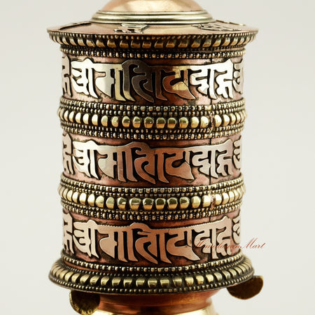 Close-up detail of Tibetan Tabletop Prayer Wheel showing intricate mantra carvings and handcrafted metalwork