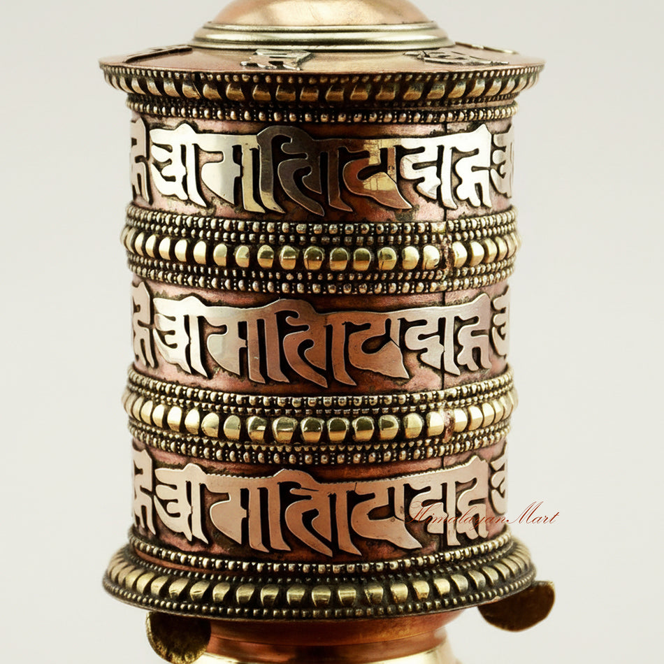 Close-up detail of Tibetan Tabletop Prayer Wheel showing intricate mantra carvings and handcrafted metalwork