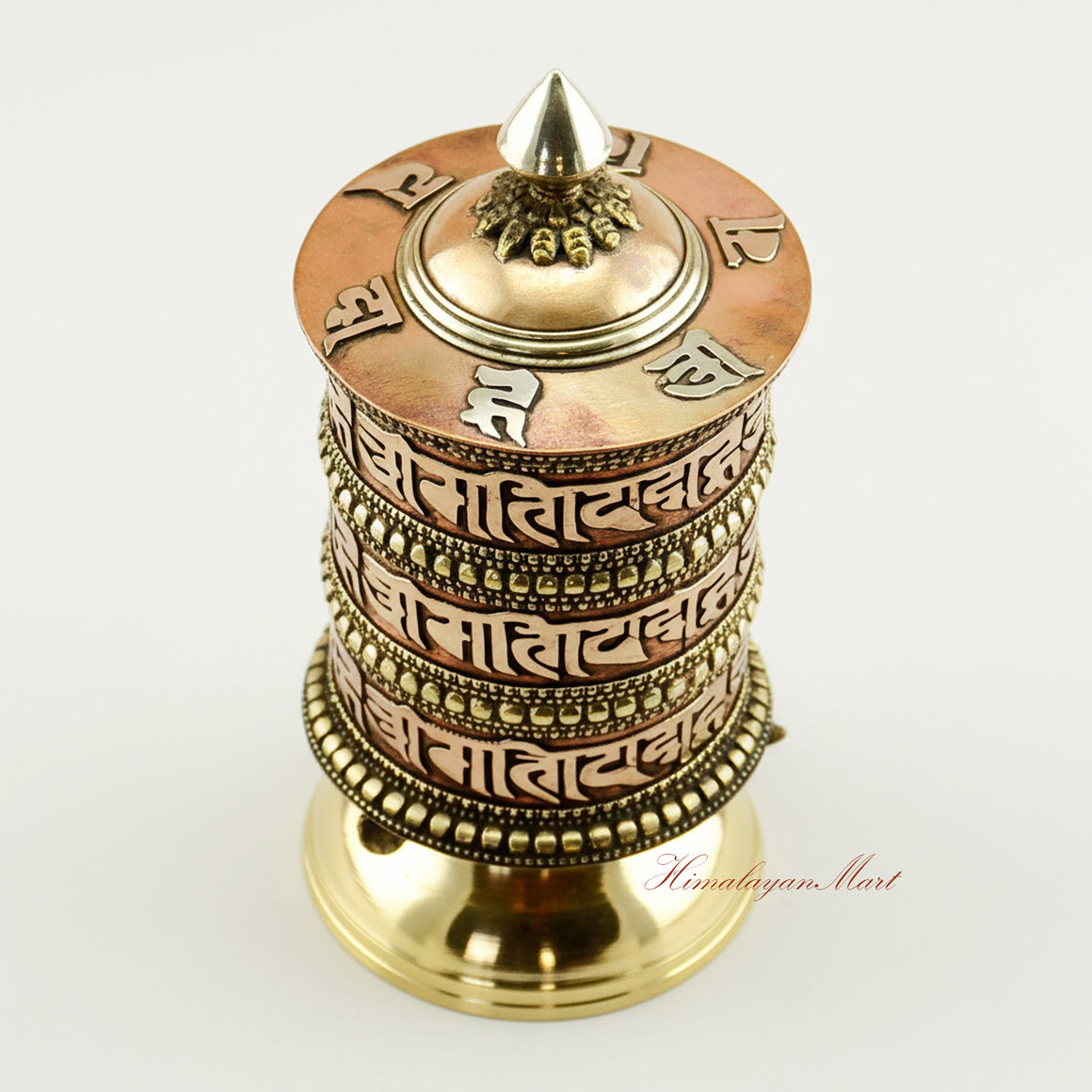 Upper view of Tibetan Tabletop Prayer Wheel highlighting sacred inscriptions and artisan craftsmanship