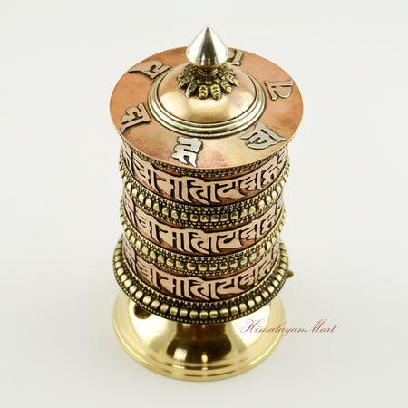 Upper view of Tibetan Tabletop Prayer Wheel highlighting sacred inscriptions and artisan craftsmanship