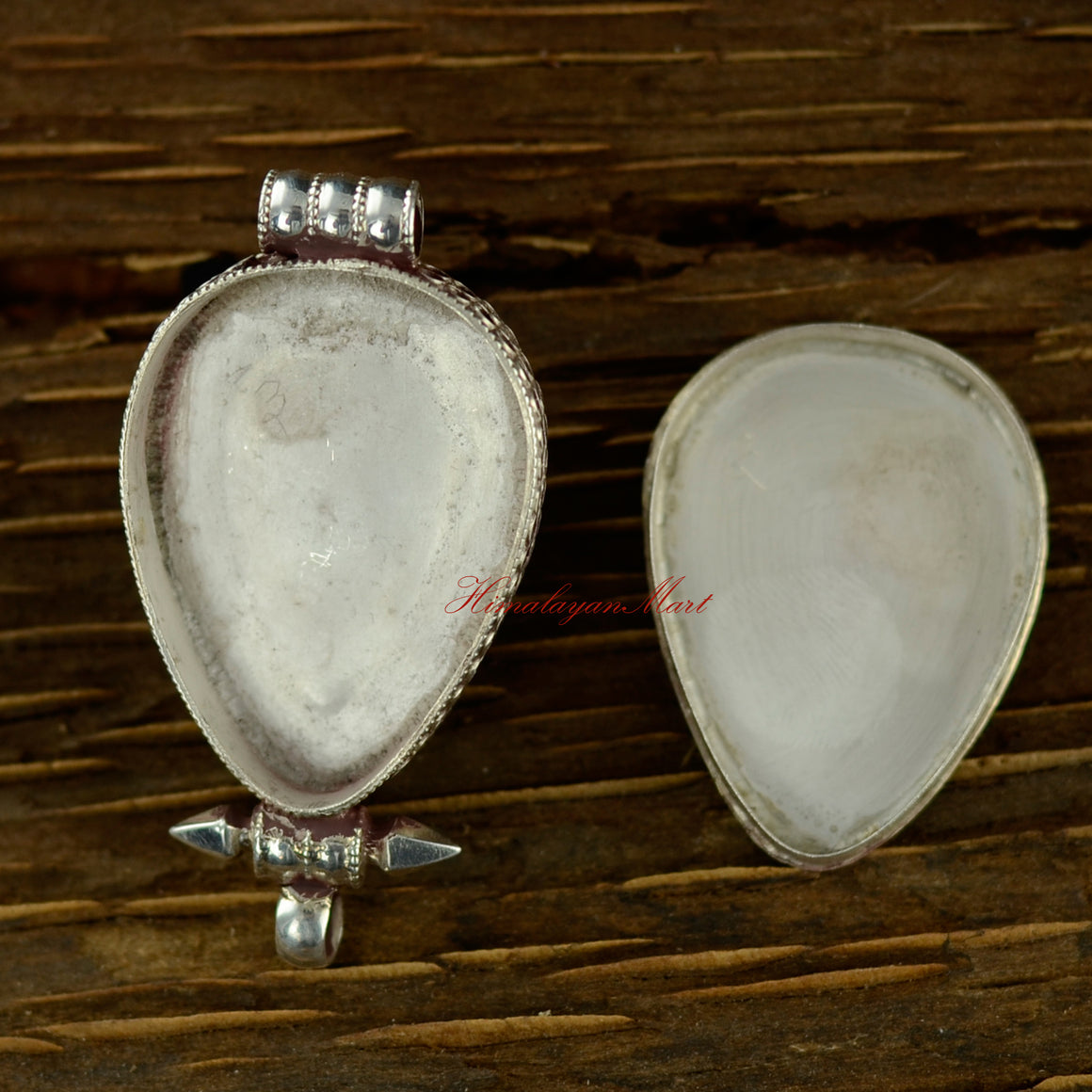 Opened view of the turquoise silver pendant showing interior space and intricate craftsmanship.