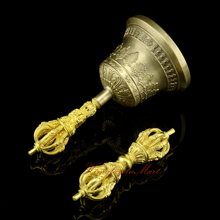 Left side view of handcrafted 9-pronged vajra and golden-brown bell set
