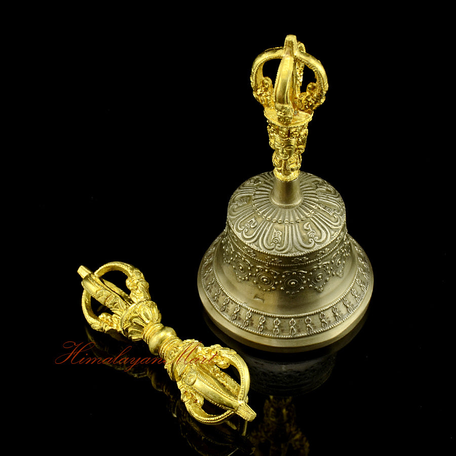 Side profile of 5-pronged vajra and golden-brown patina bell
