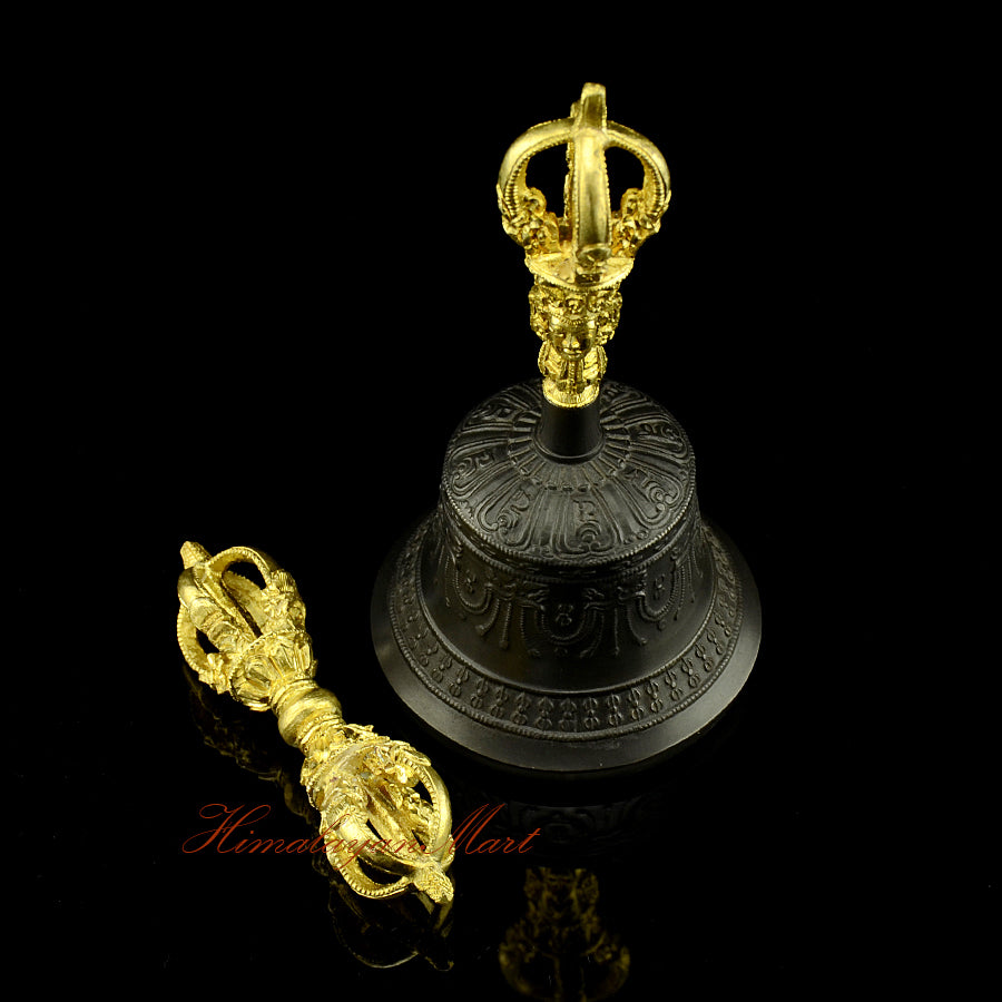 Side profile of 5-pronged vajra and black patina bell