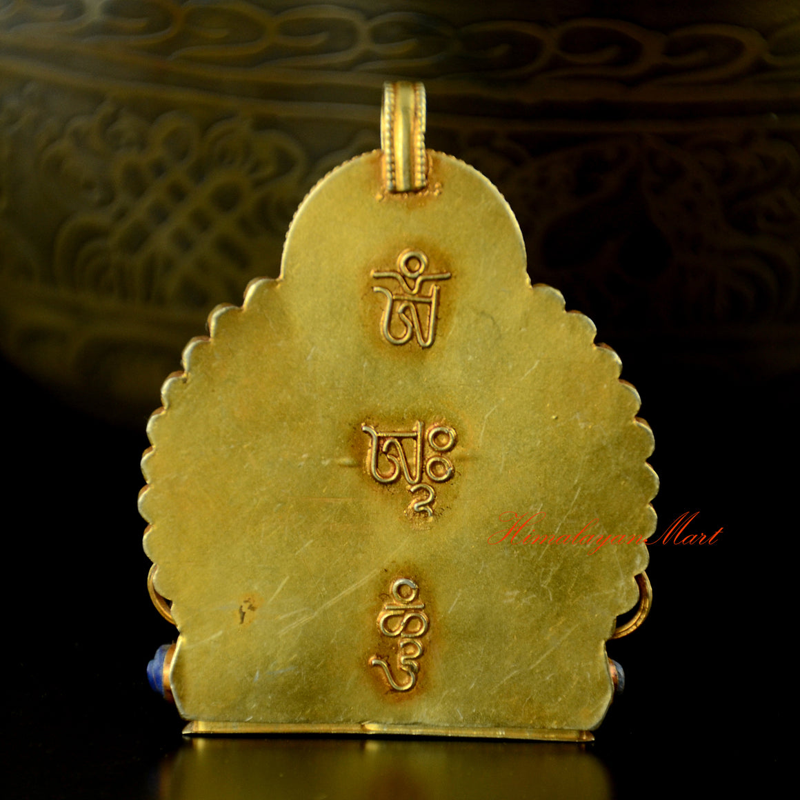 Back view of Vajrasattva Silver Pendant showing gold-plated silver craftsmanship and detailed carving