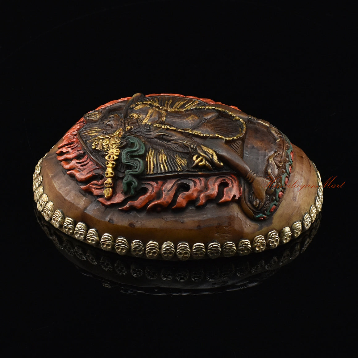 Left side view of the Vajrayogini Carved Resin Kapala with hand-painted skull cup design